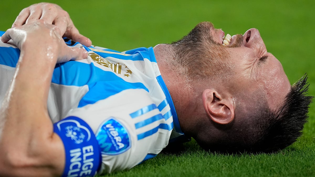 Argentina's Lionel Messi grimaces during the Copa America final soccer match against Colombia in Miami Gardens, Fla., Sunday, July 14, 2024. - AP Photo/Rebecca Blackwell